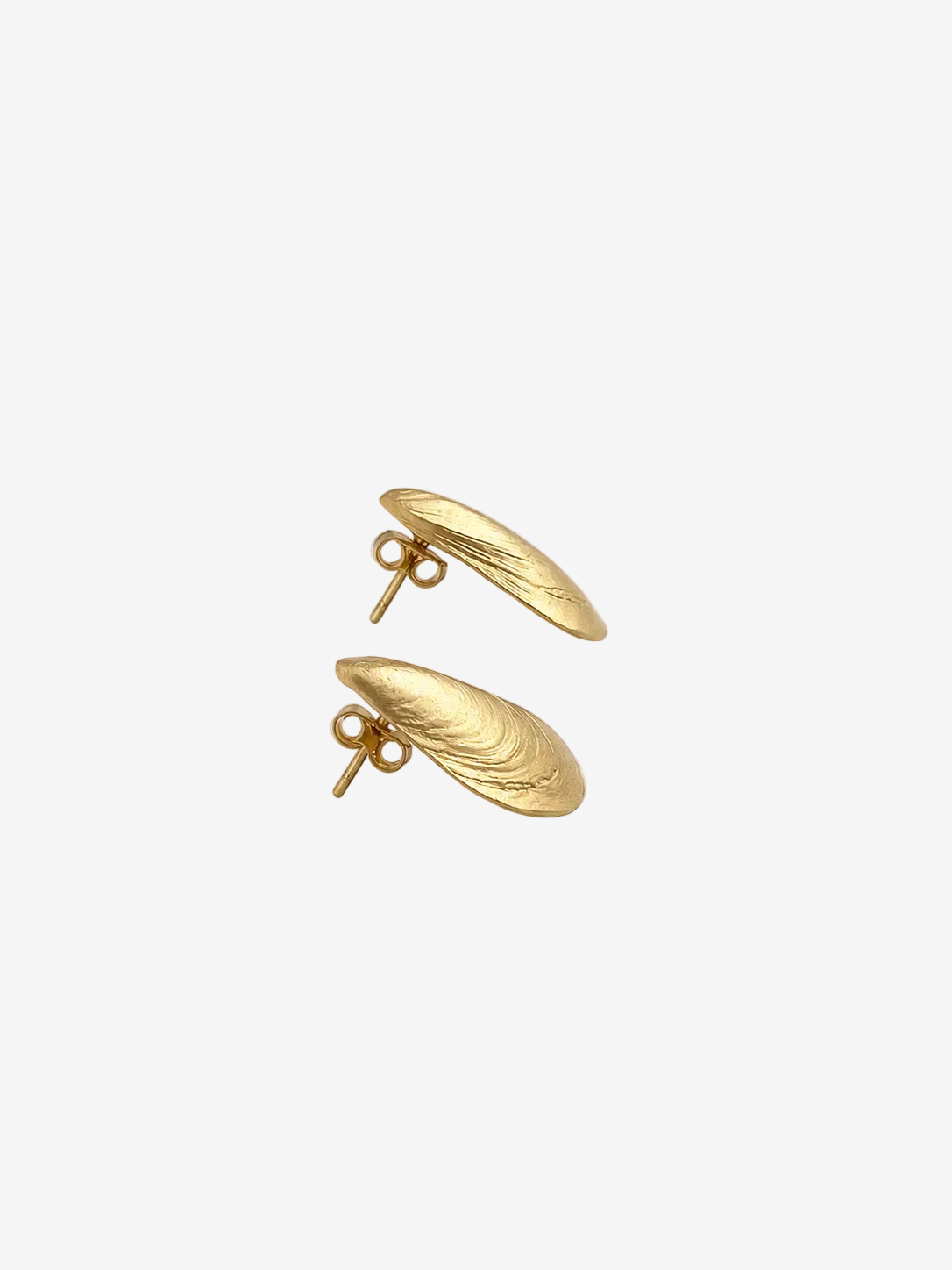 Pair of gold earrings on a light gray background