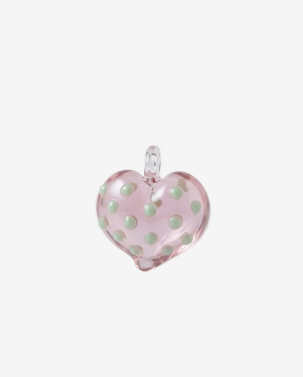 atrani studio Pink heart-shaped pendant with green polka dots on a white background