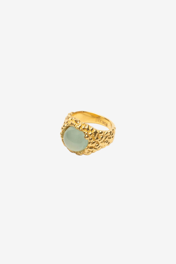 atrani studio Gold ring with a light green gemstone on a white background