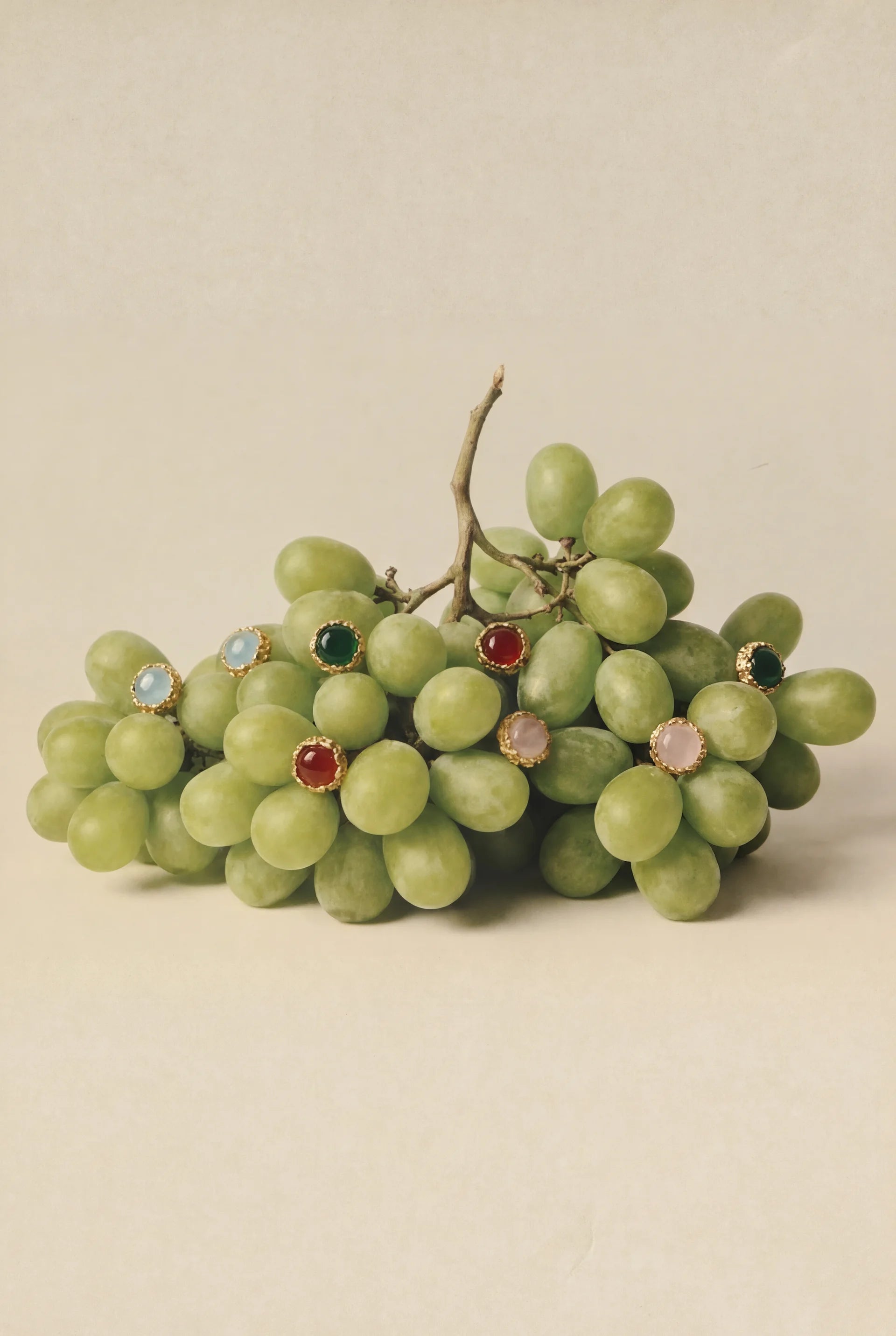 Atrani Studio Paris – organic bubble jewelry displayed on green grapes, lost-wax casting handcrafted pieces, natural imperfection, French creative jewelry studio