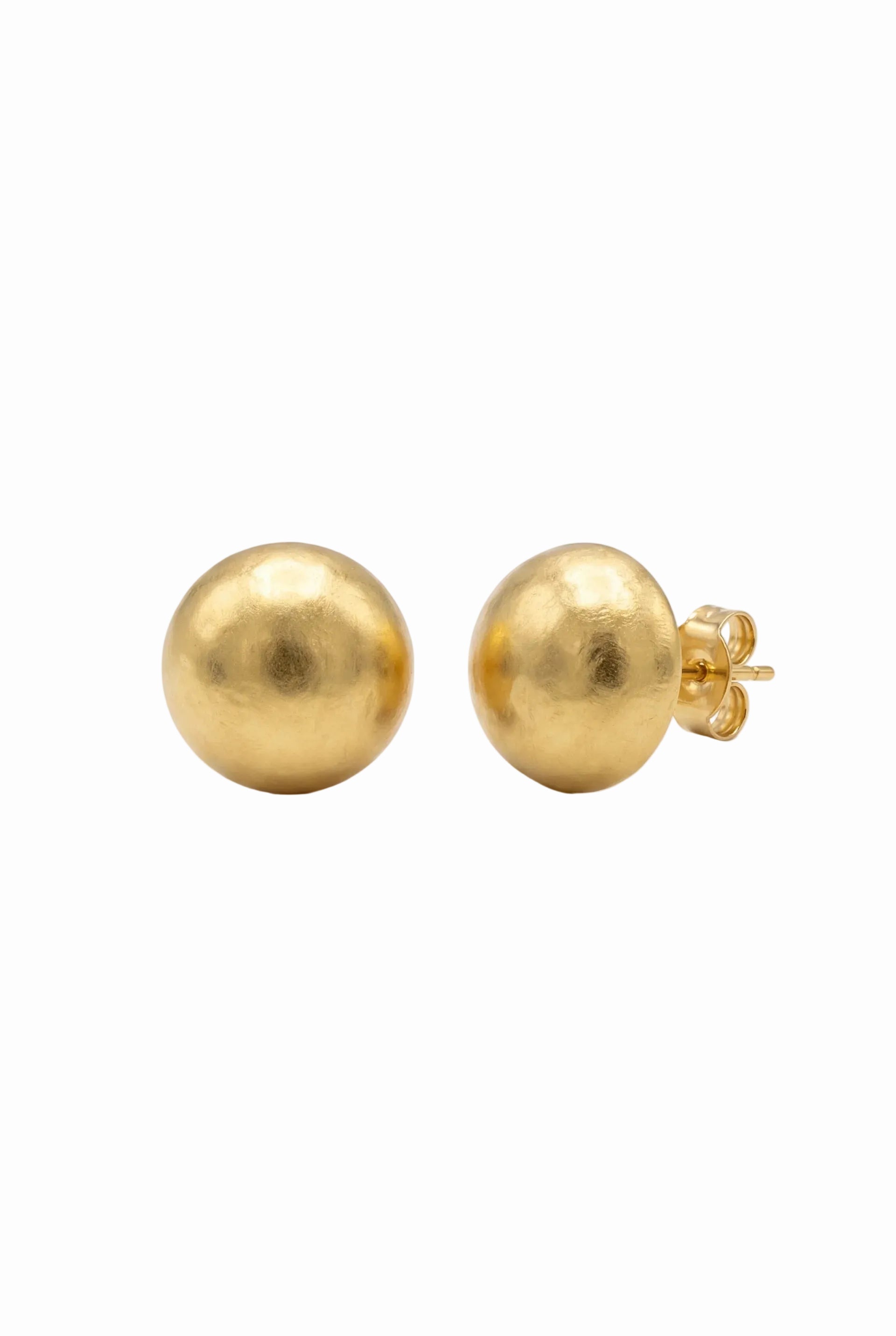 Gold ball earrings on a white background